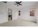 Neutral bedroom with carpet and a modern ceiling fan at 11185 Black Fire Opal Dr, Las Vegas, NV 89138