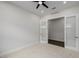 A bedroom features plush carpet and a glass door entry to another room at 11185 Black Fire Opal Dr, Las Vegas, NV 89138