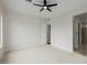A bright bedroom features neutral carpet and a ceiling fan, providing a calming and comfortable space at 11185 Black Fire Opal Dr, Las Vegas, NV 89138