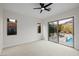 Bright bedroom with neutral carpet and access to the backyard pool at 11185 Black Fire Opal Dr, Las Vegas, NV 89138