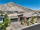 Modern home with brick driveway and landscaping in a hillside community at 11185 Black Fire Opal Dr, Las Vegas, NV 89138