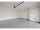 A spacious garage with epoxy flooring and an automatic door at 11185 Black Fire Opal Dr, Las Vegas, NV 89138