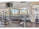 Well-equipped fitness center with weights, machines, and mirrored walls for a complete workout experience at 11185 Black Fire Opal Dr, Las Vegas, NV 89138