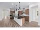 Contemporary kitchen featuring an island with granite countertop and stainless steel appliances at 11185 Black Fire Opal Dr, Las Vegas, NV 89138