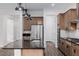 Updated kitchen showcasing stainless steel appliances, granite counters, and pendant lighting at 11185 Black Fire Opal Dr, Las Vegas, NV 89138