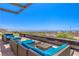 Comfortable outdoor seating area with plush cushions and scenic views of the city skyline and distant mountains at 11185 Black Fire Opal Dr, Las Vegas, NV 89138