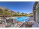 Sparkling pool surrounded by a brick patio and lush landscaping, perfect for outdoor relaxation at 11185 Black Fire Opal Dr, Las Vegas, NV 89138