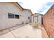 Spacious backyard features a brick wall, patio, and a shed at 1120 Mariposa Way, Boulder City, NV 89005