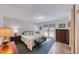 Spacious bedroom with French door access to backyard, hardwood floors and side tables at 1120 Mariposa Way, Boulder City, NV 89005