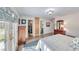 Large bedroom with back yard access, dark dresser, closet and adjoining bathroom at 1120 Mariposa Way, Boulder City, NV 89005