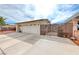 Spacious two-car garage featuring a side gate, providing additional privacy and security at 1120 Mariposa Way, Boulder City, NV 89005