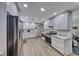 Modern kitchen with stainless steel appliances, white cabinetry, and marble countertops at 1120 Mariposa Way, Boulder City, NV 89005
