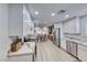 Spacious kitchen featuring stainless steel appliances, custom cabinetry, and an open dining area at 1120 Mariposa Way, Boulder City, NV 89005