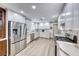 Modern kitchen with stainless steel appliances, white cabinetry, and marble countertops at 1120 Mariposa Way, Boulder City, NV 89005