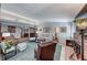 Well-lit living room with comfortable furniture, fireplace and adjoining rooms at 1120 Mariposa Way, Boulder City, NV 89005