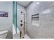 Modern shower with marble tiling, rainfall shower head and built in shelf at 1120 Mariposa Way, Boulder City, NV 89005