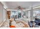 Bright sunroom featuring sliding glass doors, wood-look floors, and comfortable seating at 1120 Mariposa Way, Boulder City, NV 89005