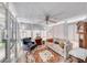 Inviting sunroom featuring large windows, comfortable seating, ceiling fan, and neutral decor at 1120 Mariposa Way, Boulder City, NV 89005