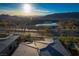 Daytime aerial view of luxury homes and a scenic pond. Great landscape and mountain views at 13 Porto Malaga St, Henderson, NV 89011