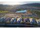 Daytime aerial view of luxury homes and a scenic pond. Great landscape and mountain views at 13 Porto Malaga St, Henderson, NV 89011