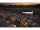 Sunset aerial view of a luxurious neighborhood with mountain views and a beautiful pond at 13 Porto Malaga St, Henderson, NV 89011