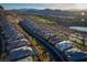 A high angle view of a well designed neighborhood with houses, pool and golf course at 13 Porto Malaga St, Henderson, NV 89011