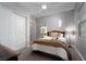 Comfortable bedroom with a cozy bed, natural light, and a view of the outdoors at 13 Porto Malaga St, Henderson, NV 89011