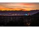 Spectacular evening cityscape with vibrant sky over mountain range at 13 Porto Malaga St, Henderson, NV 89011
