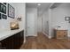 Hallway with hardwood floors, storage, and neutral walls, illuminated by recessed lighting at 13 Porto Malaga St, Henderson, NV 89011