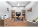 Bright office with wooden desk, bookcases, and a neutral color scheme at 13 Porto Malaga St, Henderson, NV 89011