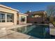 Beautiful private pool with desert landscaping and a clear view of blue skies at 13 Porto Malaga St, Henderson, NV 89011