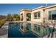 Private pool surrounded by landscaping with seamless access to the home's elegant interior at 13 Porto Malaga St, Henderson, NV 89011