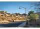 Street view with desert landscaping and serene mountain views in a quiet community at 13 Porto Malaga St, Henderson, NV 89011