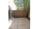 A private backyard area featuring a small patio, landscaping, and block wall fence at 1607 Colloquium Dr # 0, Henderson, NV 89014