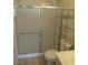 Bathroom featuring a shower with sliding doors and a functional shelving unit at 1607 Colloquium Dr # 0, Henderson, NV 89014