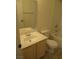 Cozy bathroom featuring a neutral-toned vanity with a large mirror and a toilet at 1607 Colloquium Dr # 0, Henderson, NV 89014