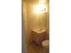 Small bathroom with a vanity, mirror, standard toilet and light fixtures at 1607 Colloquium Dr # 0, Henderson, NV 89014