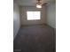 Bright bedroom features plush carpet, a ceiling fan, and a window for natural light at 1607 Colloquium Dr # 0, Henderson, NV 89014