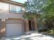 Charming two-story home with a front yard, desert landscaping, and an attached garage at 1607 Colloquium Dr # 0, Henderson, NV 89014