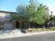 Charming two-story home with a front yard, desert landscaping, and an attached garage at 1607 Colloquium Dr # 0, Henderson, NV 89014