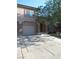Charming two-story home with a front yard, desert landscaping, and an attached garage at 1607 Colloquium Dr # 0, Henderson, NV 89014