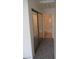 Hallway leading to the bathroom featuring a mirrored closet at 1607 Colloquium Dr # 0, Henderson, NV 89014