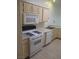 Functional kitchen featuring standard appliances, wooden cabinets and a double sink at 1607 Colloquium Dr # 0, Henderson, NV 89014