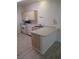 Functional kitchen featuring standard appliances, wooden cabinets, and an breakfast bar at 1607 Colloquium Dr # 0, Henderson, NV 89014