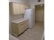 Bright kitchen showcasing ample cabinet space and a full-sized refrigerator, perfect for daily living at 1607 Colloquium Dr # 0, Henderson, NV 89014