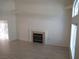 Bright living room with a cozy fireplace, neutral walls and light-colored floors at 1607 Colloquium Dr # 0, Henderson, NV 89014
