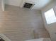 Sunlit living room with wood flooring and an attractive fireplace, viewed from above at 1607 Colloquium Dr # 0, Henderson, NV 89014
