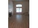 Bright living room featuring light-colored floors, neutral walls, and sunlit windows at 1607 Colloquium Dr # 0, Henderson, NV 89014