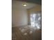 Bright living room featuring light-colored floors, neutral walls, and sunlit windows at 1607 Colloquium Dr # 0, Henderson, NV 89014