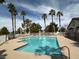 Beautiful community pool with palm trees and desert landscaping at 1607 Colloquium Dr # 0, Henderson, NV 89014
